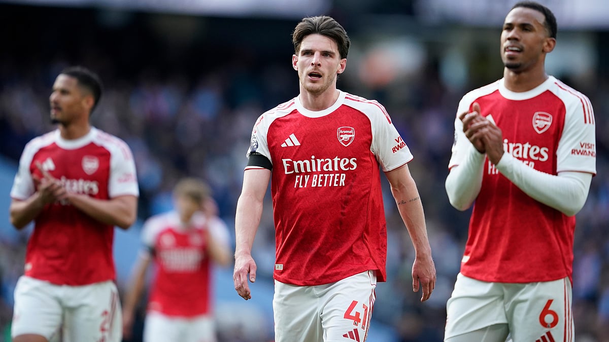 | Photo: AP/Dave Thompson : Arsenal's Declan Rice and his teammate Gabriel react at the end of the English Premier League soccer match between Manchester City and and Arsenal, in Manchester, England, Sunday, April 19, 2026. 