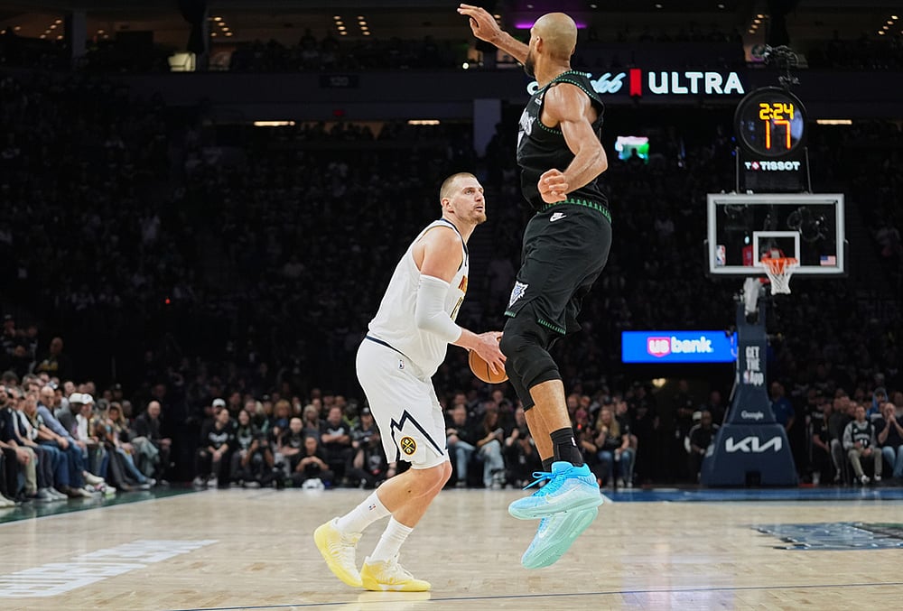 | Photo: AP/Abbie Parr : Denver Nuggets center Nikola Jokic (15), back, looks to shoot as Minnesota Timberwolves center Rudy Gobert (27) defends during the first half in Game 3 of a first-round NBA basketball playoff series in Minneapolis. 
