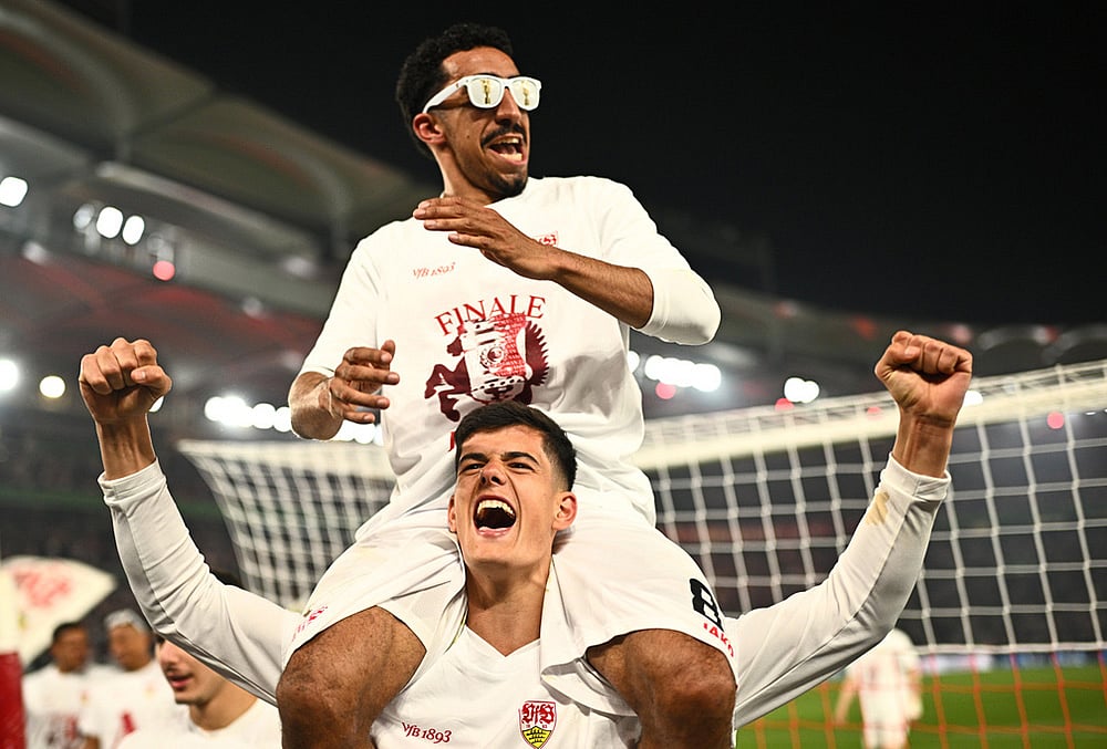 | Photo: Tom Weller/dpa via AP : Stuttgarts Chema Andres, bottom, and and Tiago Tomas celebrate after a German Cup semifinal soccer match between VfB Stuttgart and SC Freiburg, in Stuttgart, Germany. 