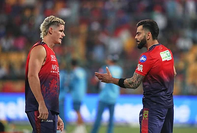| Photo: AP : Royal Challengers Bengalurus Virat Kohli talks to Jacob Bethell during the warm up before the start of the Indian Premier League cricket match between Royal Challengers Bengaluru and Gujarat Titans in Bengaluru.