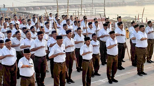 | Photo: PTI | Representative Image : Rashtriya Swayamsevak Sangh (RSS) workers take part in a programme on the first day of the Hindu New Year, in Prayagraj.