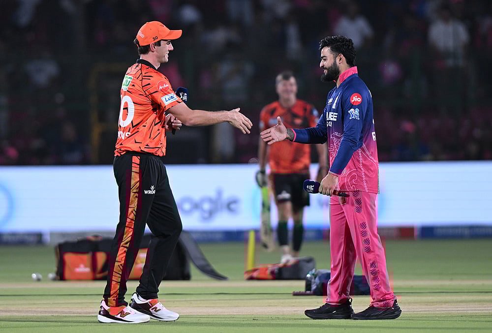 | Photo: AP : Sunrisers Hyderabads captain Pat Cummins, left, and Rajasthan Royals captain Riyan Parag shake hands after coin toss before the Indian Premier League cricket match between Rajasthan Royals and Sunrisers Hyderabad in Jaipur.