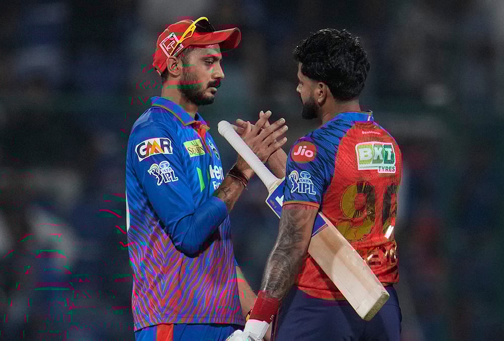 | Photo: AP/Manish Swarup : Delhi Capitals captain Axar Patel, left, congratulates Punjab Kings captain Shreyas Iyer after Punjab Kings win the Indian Premier League cricket match between Delhi Capitals and Punjab Kings in New Delhi.