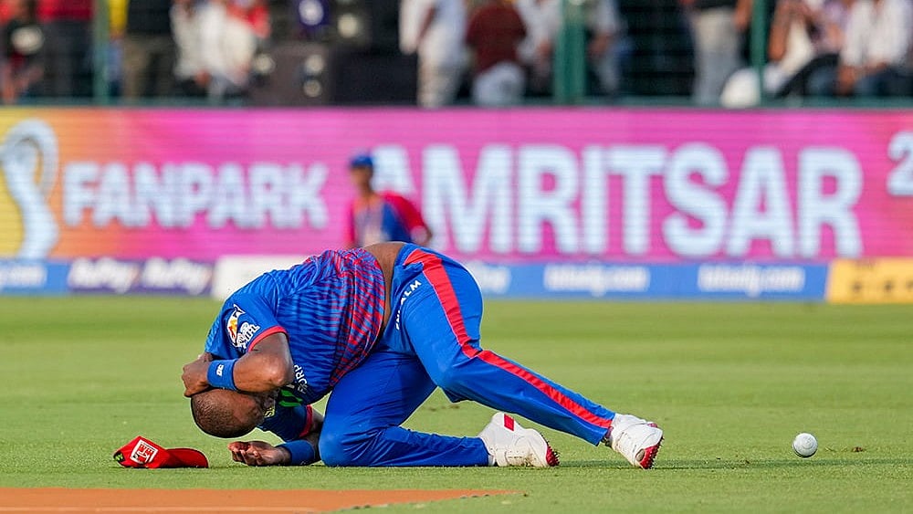 | Photo: PTI/Karma Bhutia : Delhi Capitals Lungi Ngidi reacts to an injury during the Indian Premier League (IPL) 2026 T20 cricket match between Delhi Capitals and Punjab Kings, in New Delhi.