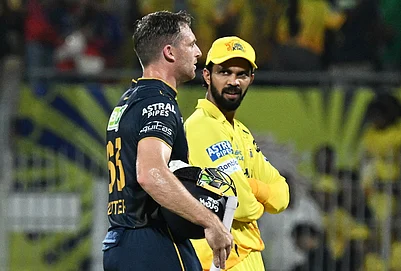 | Photo: AP : Gujarat Titans Jos Buttler, left, walks with Chennai Super Kings captain Ruturaj Gaikwad after Gujarat Titans won the Premier League cricket match against Chennai Super Kings in Chennai.