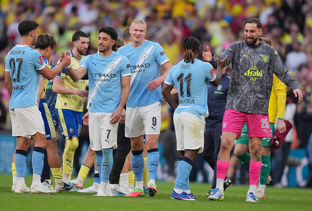 | Photo: AP/Kin Cheung : Manchester City players celebrate after the FA Cup semifinal soccer match between Manchester City and Southampton in Manchester, England.