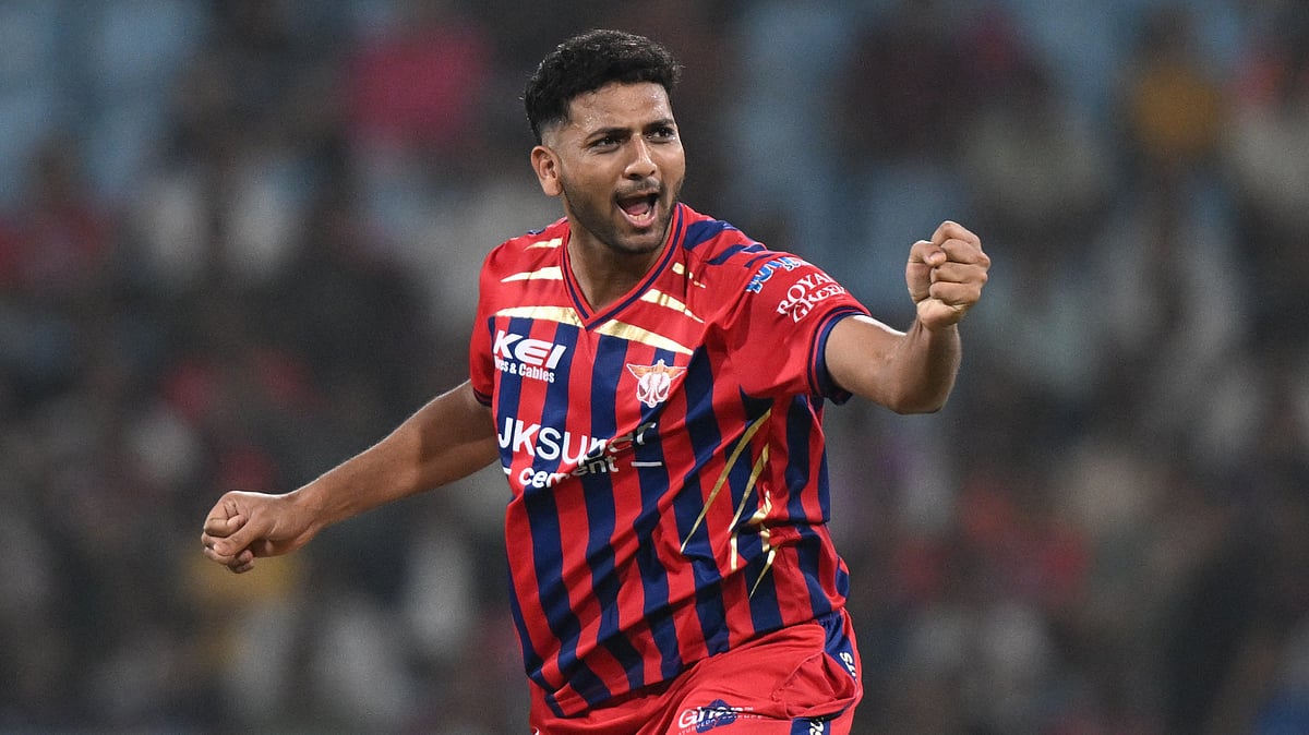 AP Photo : Lucknow Super Giants Mohsin Khan celebrates the wicket of Kolkata Knight Riders Rovman Powell during the Indian Premier League cricket match between Kolkata Knight Riders and Lucknow Super Giants in Lucknow.