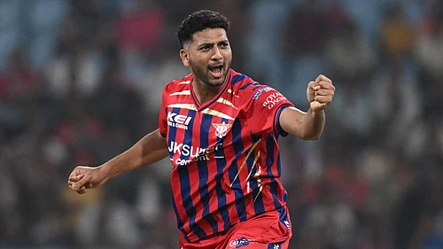 AP Photo : Lucknow Super Giants Mohsin Khan celebrates the wicket of Kolkata Knight Riders Rovman Powell during the Indian Premier League cricket match between Kolkata Knight Riders and Lucknow Super Giants in Lucknow.