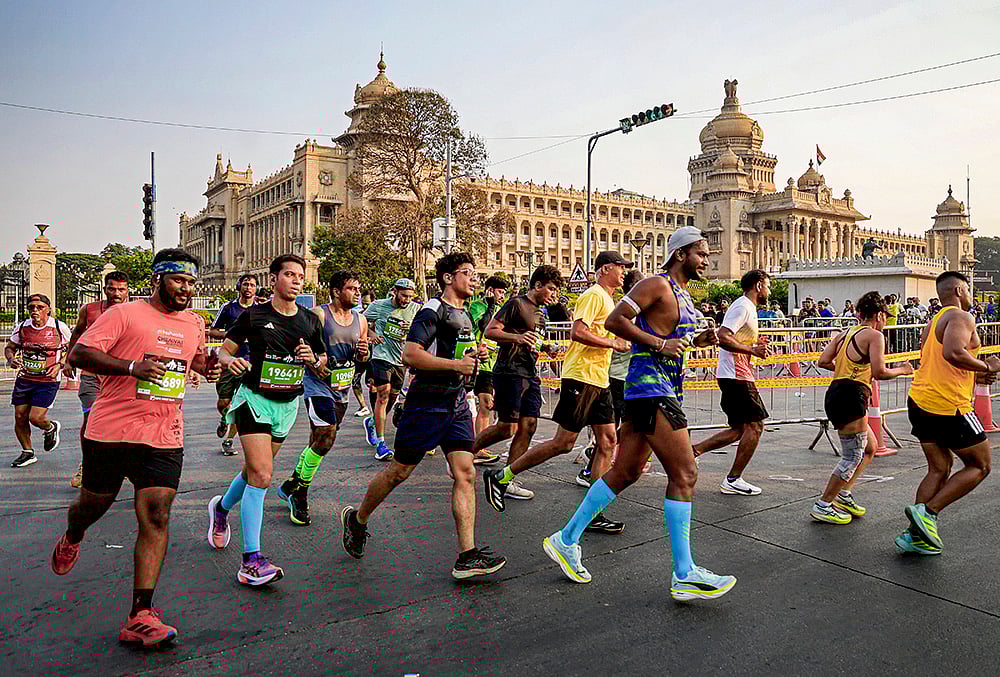 | Photo: PTI : People take part in the TCS World 10K marathon, in Bengaluru.