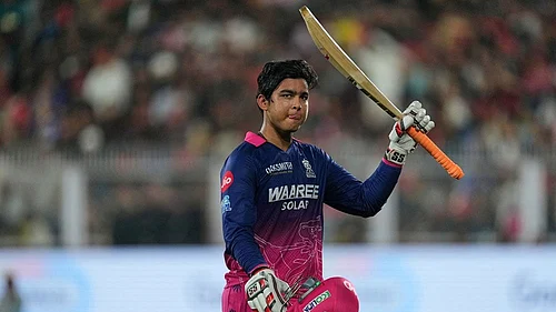 | Photo: AP/Anupam Nath : Rajasthan Royals Vaibhav Sooryavanshi waves his bat as he leaves the ground after losing his wicket during the Indian Premier League cricket match between Royal Challengers Bengaluru and Rajasthan Royals in Guwahati, India.
