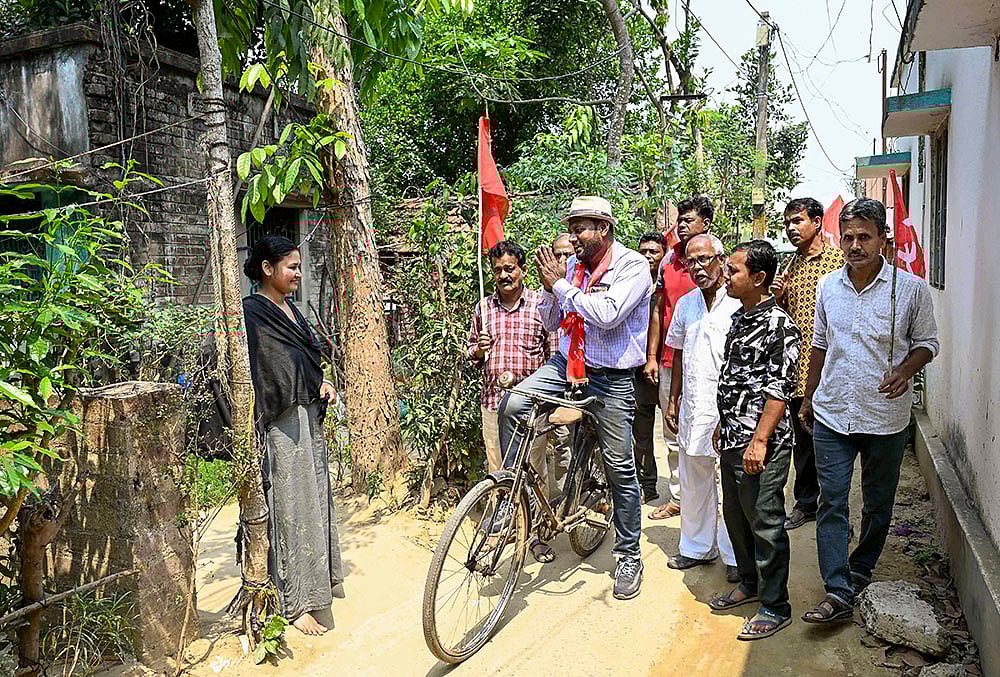 | Photo: PTI  : CPI(M) candidate from Santipur constituency, Soumen Mahato, campaigns for the West Bengal Assembly elections, in Nadia.