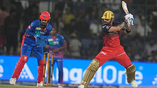 AP/Manish Swarup : Virat Kohli, right, plays a shot during the Indian Premier League match between Delhi Capitals and Royal Challengers Bengaluru in Delhi.
