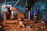 AP : A guard walks through a war-damaged section of Al Shaabi Hospital in Khartoum