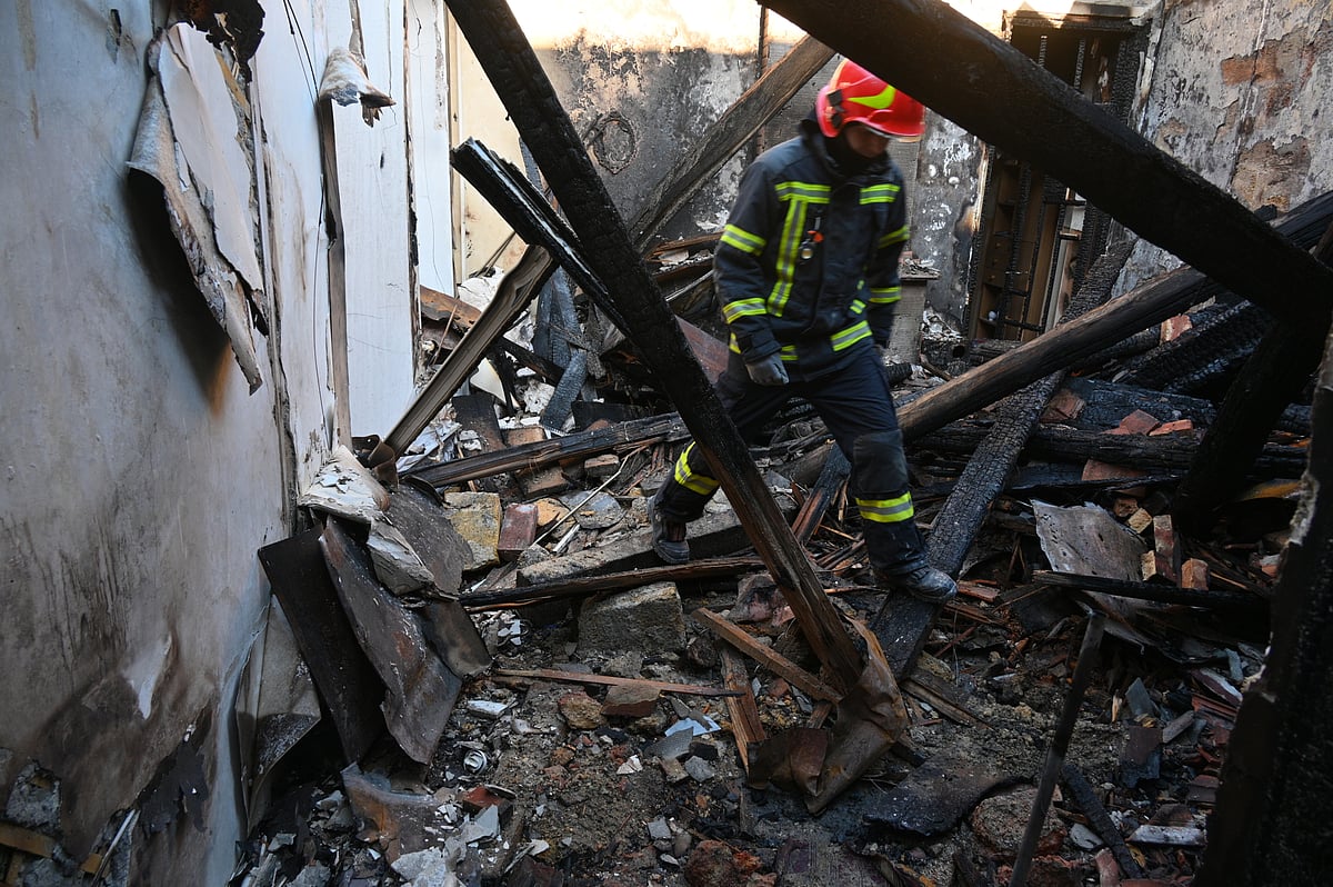  (AP Photo/Michael Shtekel) : A rescue worker walks inside apartments destroyed by a Russian strike in Odesa, Ukraine, Monday, April 27, 2026.
