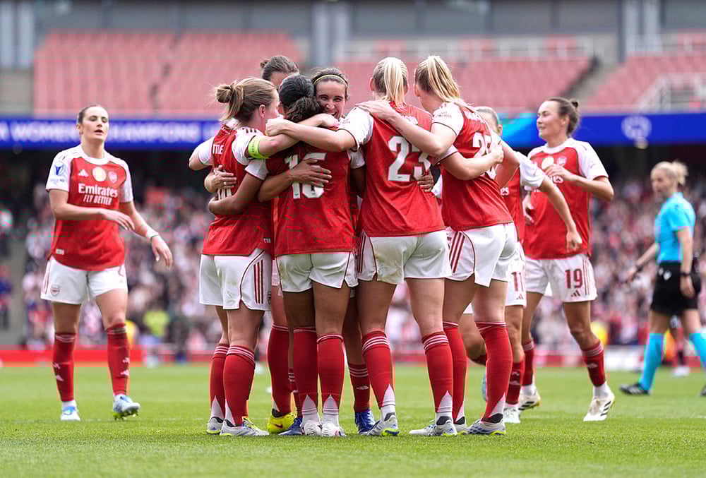 | Photo: Andrew Matthews/PA via AP : Arsenals players celebrate their sides second goal scored by Olivia Smith during the Womens Champions League semi-final, first leg soccer match between Arsenal and OL Lyonnes in London, England.