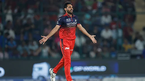 IPL/X : Bhuvneshwar Kumar celebrates a wicket during DC vs RCB IPL 2026 match at the Arun Jaitley Stadium in Delhi.