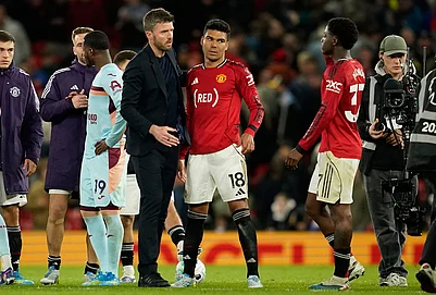 | Photo: AP/Dave Thompson : Manchester Uniteds coach Michael Carrick talks to Casemiro, center, and Kobbie Mainoo after the Premier League soccer match between Manchester United and Brentford in Manchester, England.