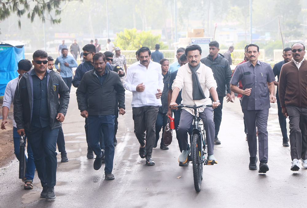 | Photo: PTI : Kodaikanal: Tamil Nadu Chief Minister MK Stalin cycles near the Kodaikanal Lake, post the election campaigns for the state Assembly elections, at Kodaikanal, in Dindigul district.