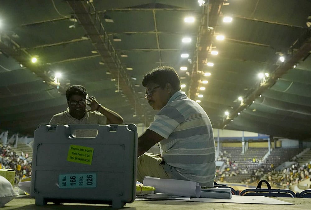 | Photo: Sandipan Chatterjee/Outlook : Polling officials check election materials for voting in the second phase of the West Bengal Assembly elections, at a distribution centre in Kolkata.