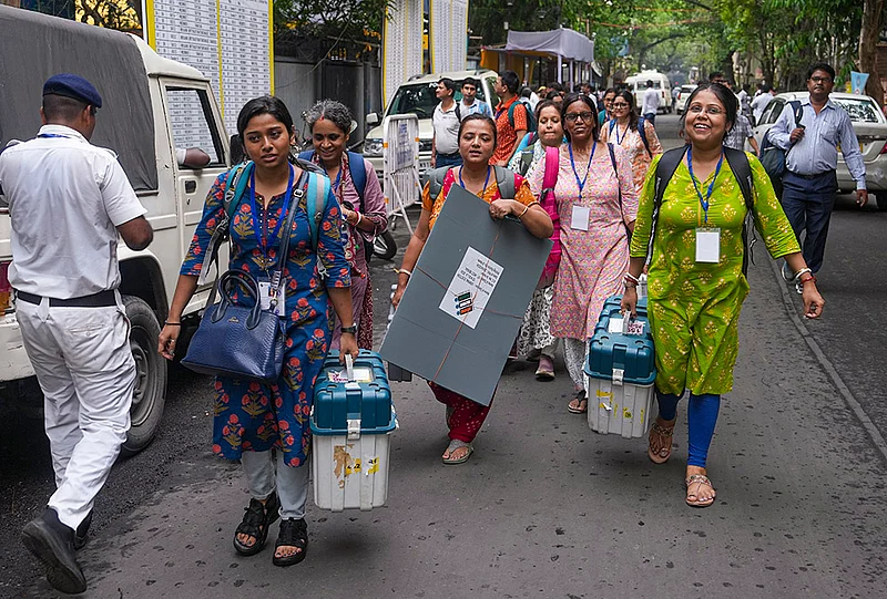 | Photo: PTI/Manvender Vashist Lav : Officials leave for their respective polling stations after collecting Electronic Voting Machine (EVM) and Voter Verifiable Paper Audit Trail (VVPAT) units for voting in the second phase of the West Bengal Assembly elections, in Kolkata.