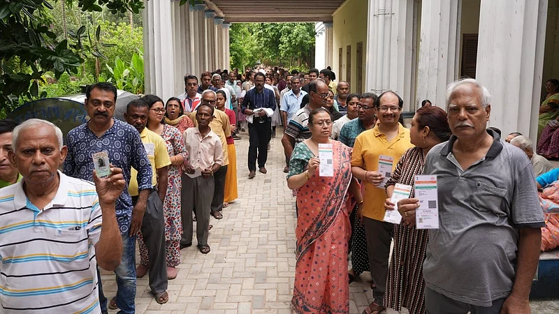Sandipan Chatterjee : People wait in a queue to cast their votes during the second phase of the West Bengal Assembly elections, in Kolkata, Wednesday, April 29, 2026.