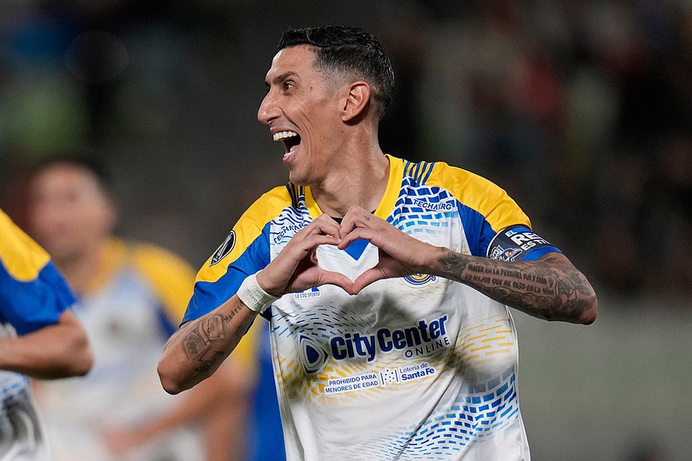 | Photo: AP/Ariana Cubillos : Angel Di Maria of Argentinas Rosario Central celebrates scoring his sides second goal, from the penalty spot, against Venezuelas Universidad Central during a Copa Libertadores Group H soccer match in Caracas, Venezuela.