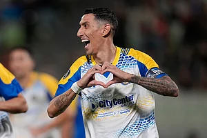 | Photo: AP/Ariana Cubillos : Angel Di Maria of Argentina's Rosario Central celebrates scoring his side's second goal, from the penalty spot, against Venezuela's Universidad Central during a Copa Libertadores Group H soccer match in Caracas, Venezuela.