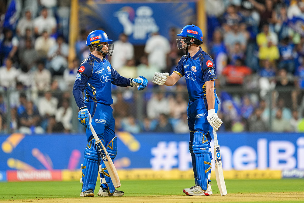 | Photo: PTI/Kunal Patil : Mumbai Indians Ryan Rickelton, left, and Will Jacks greet each other between the wickets during an Indian Premier League (IPL) 2026 T20 cricket match between Mumbai Indians and Sunrisers Hyderabad, in Mumbai, Maharashtra.