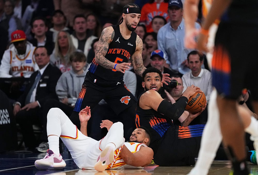 | Photo: AP/Frank Franklin II : New York Knicks Karl-Anthony Towns, right, and Jose Alvarado fights for control of the ball with Atlanta Hawks CJ McCollumm below, during the first half in Game 5 of a first-round NBA playoffs basketball series, in New York. 