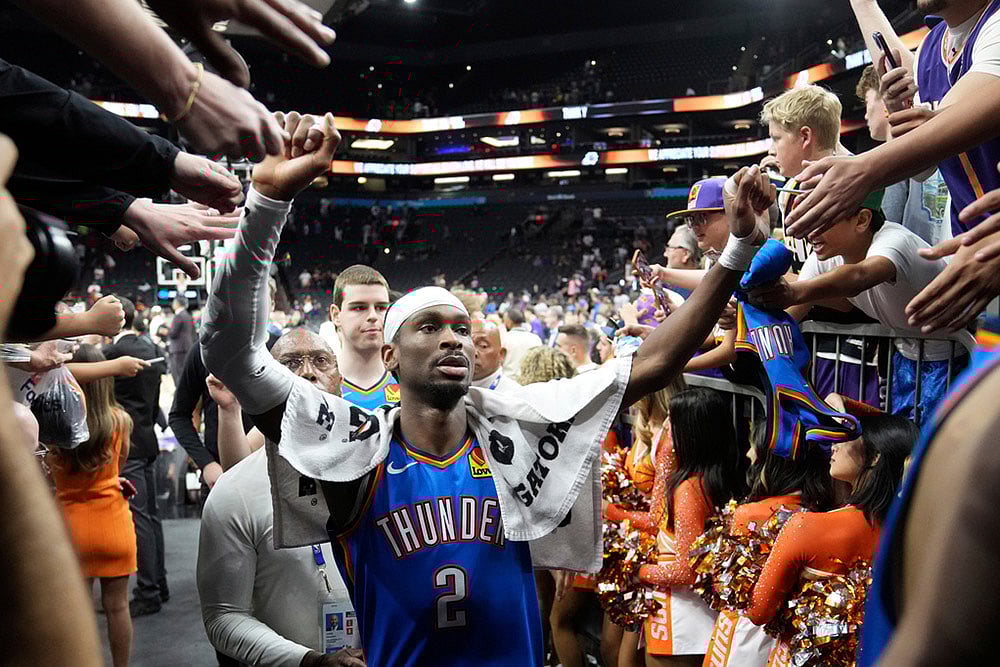 | Photo: AP/Ross D. Franklin : Oklahoma City Thunder guard Shai Gilgeous-Alexander celebrates with fans after Game 4 in a first-round NBA playoffs basketball series against the Phoenix Suns in Phoenix.
