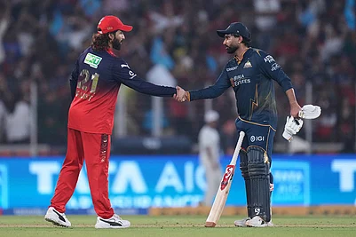 | Photo: AP/Ajit Solanki : Gujarat Titans Rahul Tewatia shakes hands with Royal Challengers Bengalurus captain Rajat Patidar after wining the Indian Premier League cricket match between Gujarat Titans and Royal Challengers Bengaluru in Ahmedabad, India.