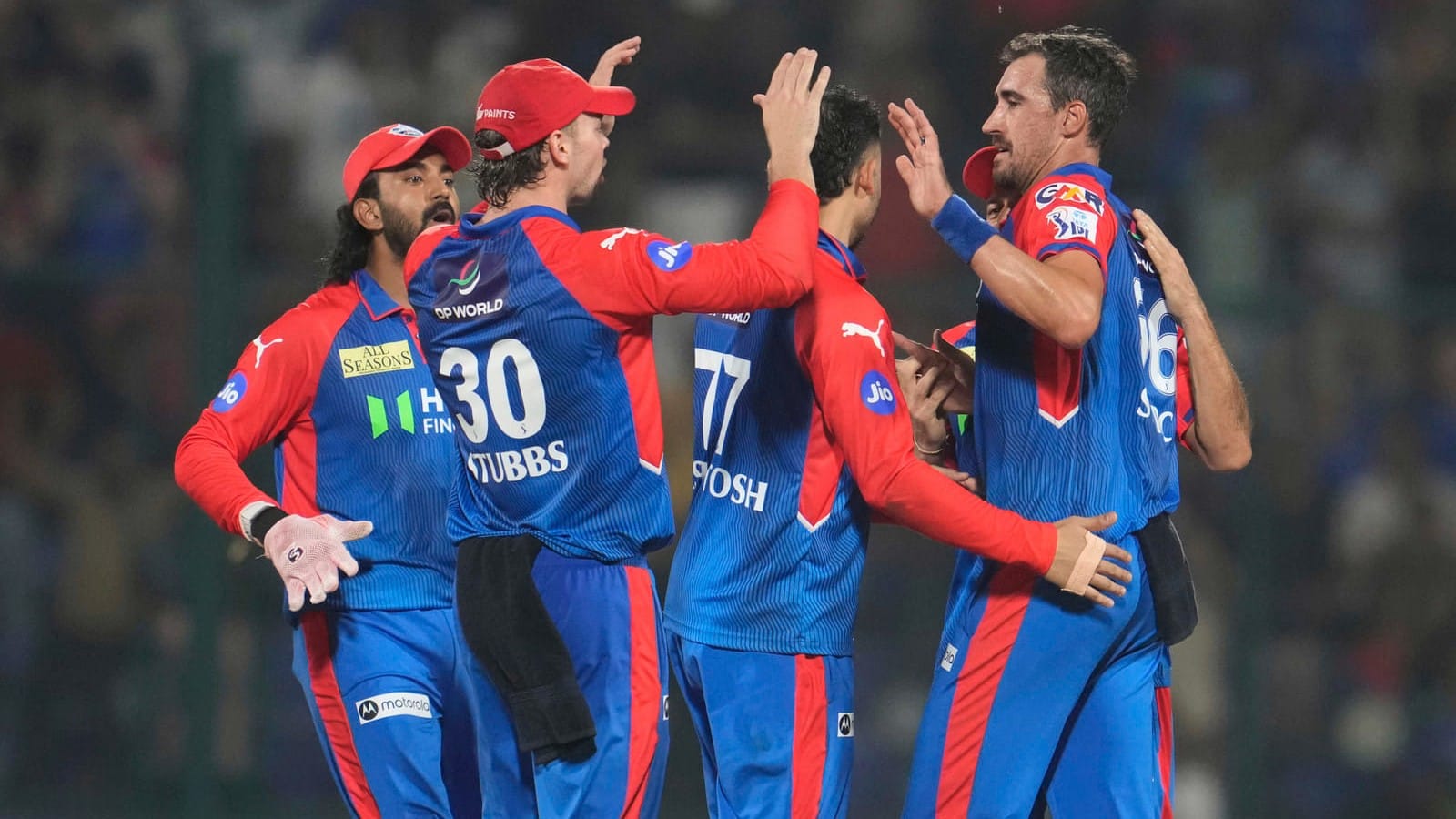 File/AP : Delhi Capitals Mitchell Starc, right, celebrates with teammates after the dismissal of Rajasthan Royals Dhruv Jurel during their Indian Premier League 2025 match.