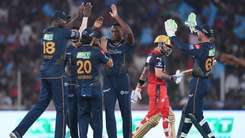 AP : Kagiso Rabada celebrates with teammates the wicket of Virat Kohli during the Indian Premier League match between Gujarat Titans and Royal Challengers Bengaluru in Ahmedabad.
