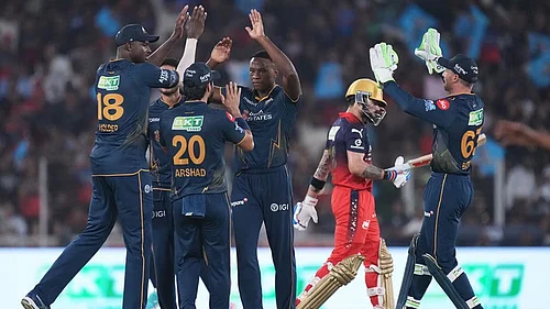 AP : Kagiso Rabada celebrates with teammates the wicket of Virat Kohli during the Indian Premier League match between Gujarat Titans and Royal Challengers Bengaluru in Ahmedabad.