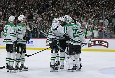 | Photo: AP/Bailey Hillesheim : Dallas Stars goaltender Jake Oettinger (29) is greeted by teammates after they lost Game 6 in the first round of the NHL hockey Stanley Cup playoff series against the Minnesota Wild, in St. Paul, Minnesota.