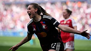 AP : Forward Jule Brand celebrates her late goal against Arsenal in the UWCL semi-final second-leg.