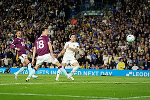 | Photo: Martin Rickett/PA via AP : Leeds United's Noah Okafor, right, scores their side's second goal during the Premier League match between Leeds United and Burnley, in Leeds, England.