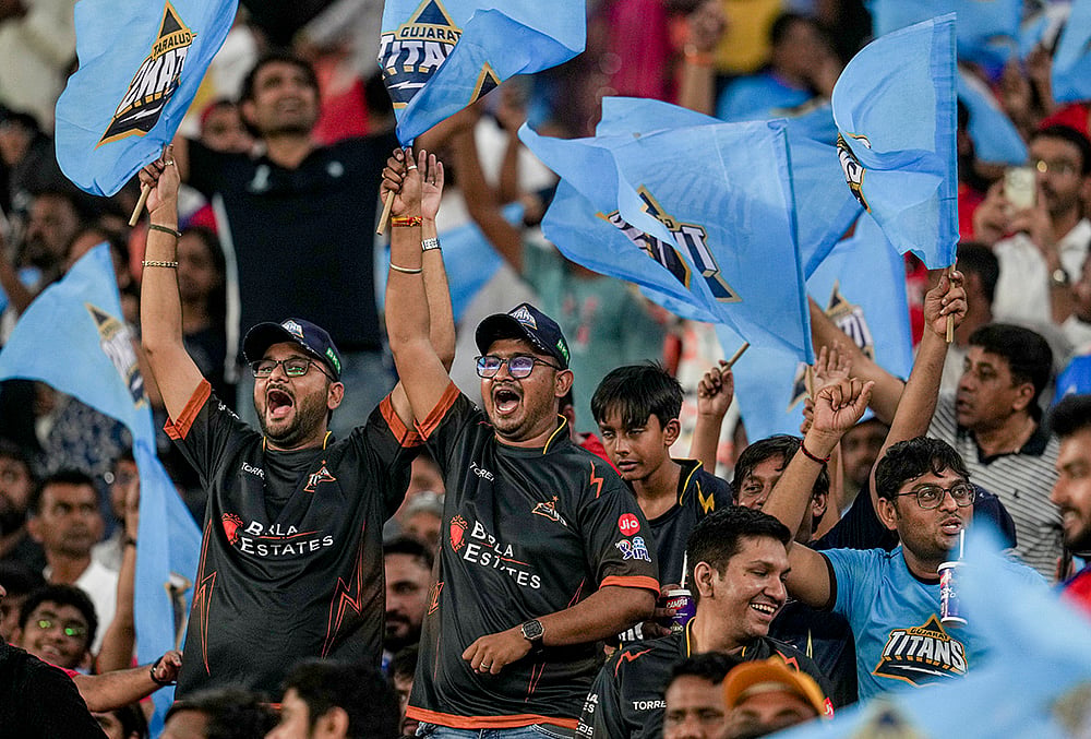 | Photo: PTI/Arun Sharma : Gujarat Titans fans cheer ahead of the Indian Premier League (IPL) 2026 T20 cricket match between Gujarat Titans and Punjab Kings, in Ahmedabad.
