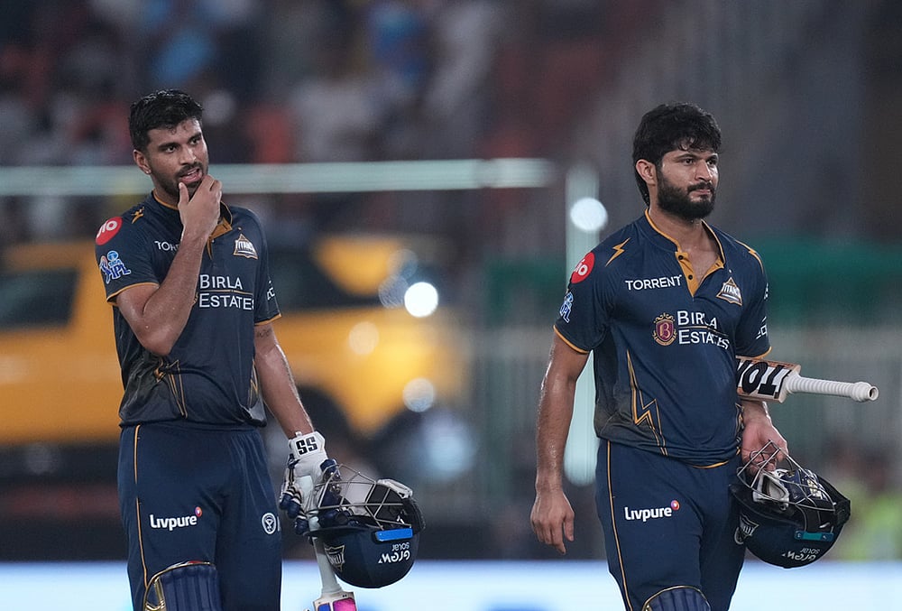 | Photo: AP/Ajit Solanki : Gujarat Titans Washington Sundar and Arshad Khanshakes following their win during the Indian Premier League cricket match between Gujarat Titans and Punjab Kings in Ahmedabad.