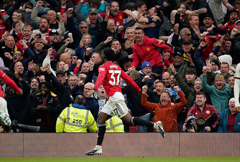 | Photo: AP/Dave Thompson : Manchester Uniteds Kobbie Mainoo celebrates after scoring his sides third goal during the English Premier League soccer match between Manchester United and Liverpool in Manchester, England.