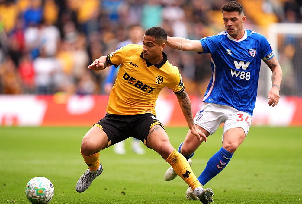 | Photo: Mike Egerton/PA via AP : Wolverhampton Wanderers Joao Gomes, left, and Sunderlands Granit Xhaka battle for the ball during their English Premier League soccer match in Wolverhampton, England.