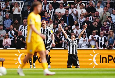 | Photo: Owen Humphreys/PA via AP : Newcastle Uniteds William Osula celebrates scoring their sides first goal of the game during their English Premier League soccer match against Brighton & Hove Albion in Newcastle, England.