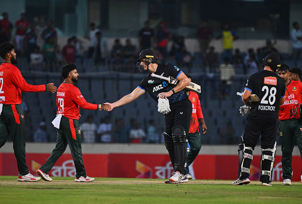 | Photo: AP/Mosaraf Hossain : New Zealands Bevon Jacobs shakes hands with Bangladeshs players after winning the third T20 international cricket match between Bangladesh and New Zealand in Mirpur, Bangladesh.