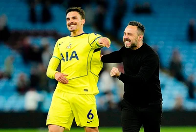 | Photo: Nick Potts/PA via AP : Tottenham Hotspurs Joao Palhinha, left, and manager Roberto de Zerbi celebrate after the English Premier League soccer match between Aston Villa and Tottenham Hotspur in Birmingham, England.
