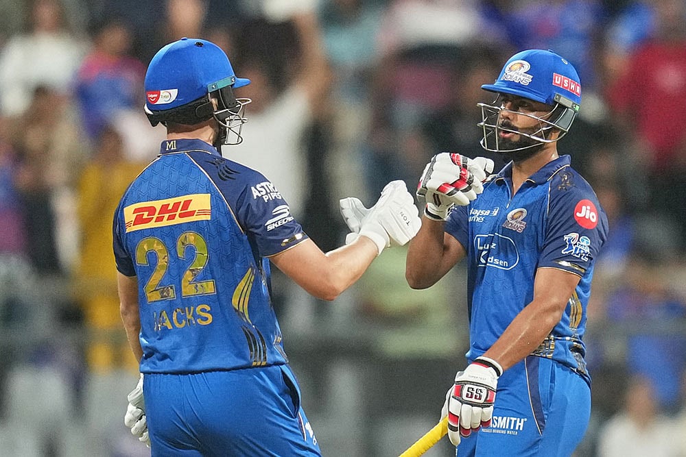 | Photo: AP/Rafiq Maqbool : Mumbai Indians Will Jack, left, and Naman Dhir celebrate their win during the Indian Premier League cricket match between Mumbai Indians and Lucknow Super Giants in Mumbai, India.