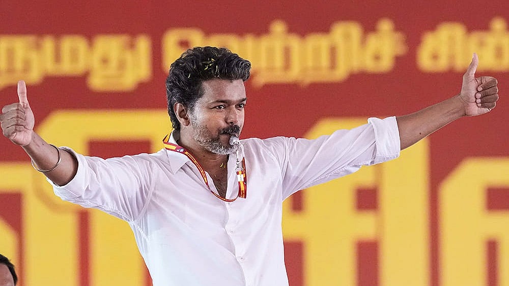 | Photo: PTI/R Senthilkumar : Tamilaga Vettri Kazhagam (TVK) chief Vijay during a public meeting ahead of the Tamil Nadu Assembly elections, in Chennai.