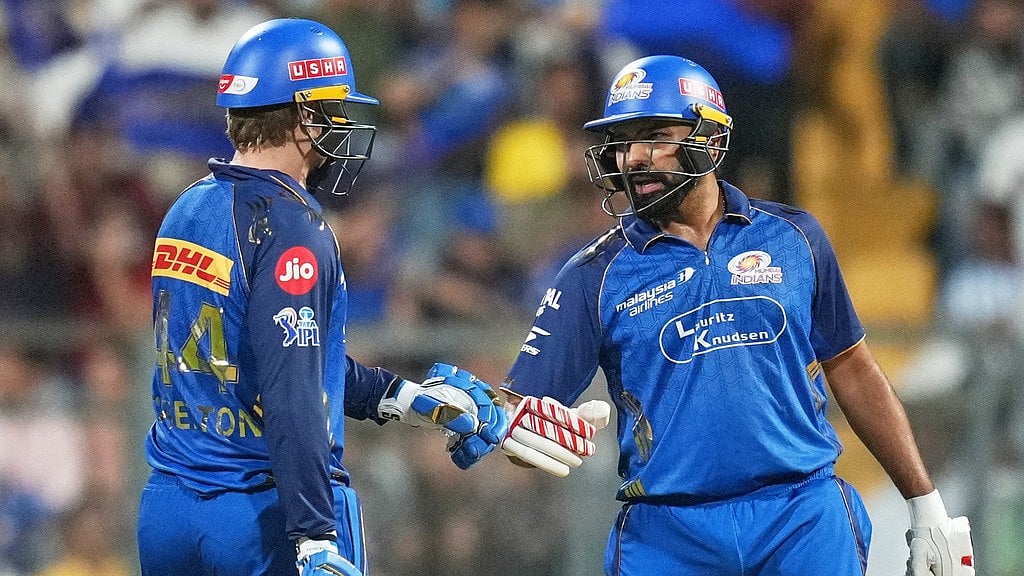 Photo: AP/Rafiq Maqbool : Ryan Rickelton, left, and Rohit Sharma bat during the Indian Premier League match between Mumbai Indians and Lucknow Super Giants in Mumbai.
