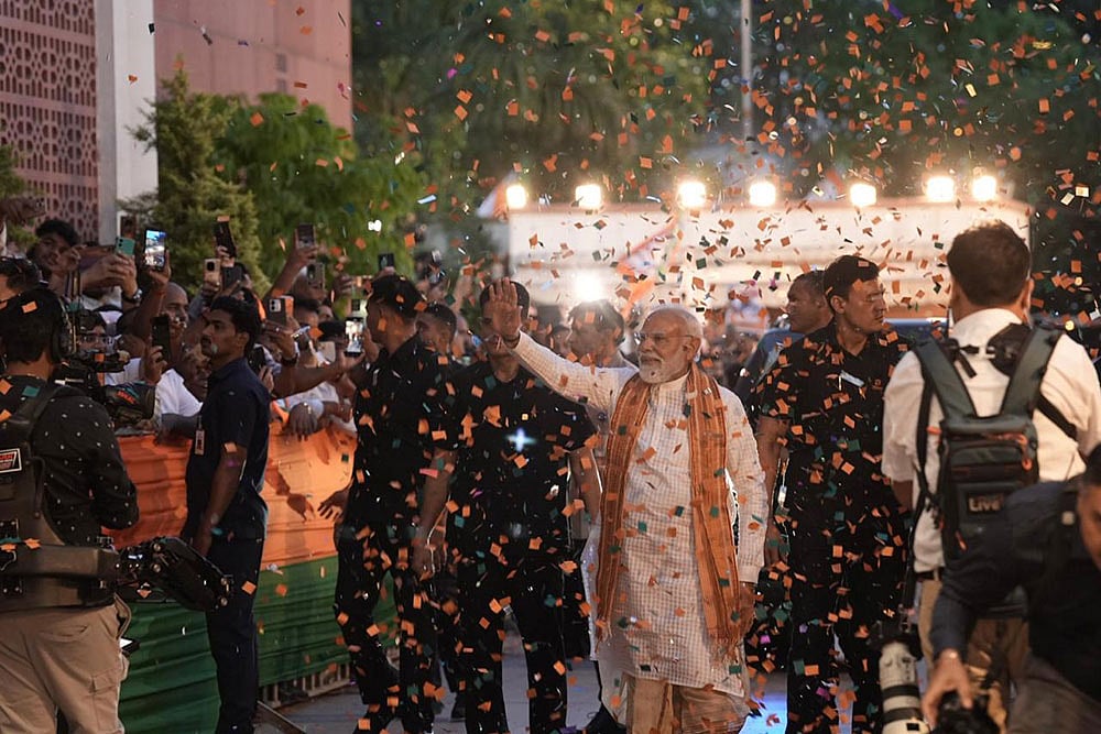 Photo: Tribhuvan Tiwari : Prime Minister Narendra Modi arrives at the BJP headquarters to celebrate the partys performance in Assembly elections across four states and one union territory, in New Delhi.
