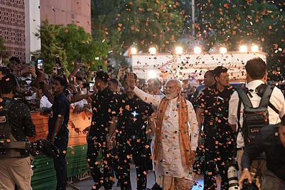 Photo: Tribhuvan Tiwari : Prime Minister Narendra Modi arrives at the BJP headquarters to celebrate the partys performance in Assembly elections across four states and one union territory, in New Delhi.