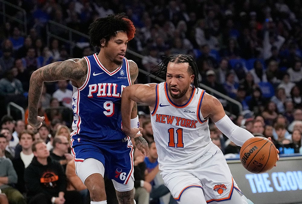 | Photo: AP/Seth Wenig : New York Knicks Jalen Brunson, right, drives past Philadelphia 76ers Kelly Oubre Jr. during the first half of Game 1 in a second-round NBA basketball playoffs series in New York. 